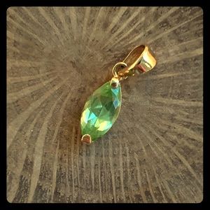 Peridot on gold charm